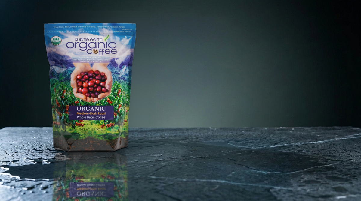 A bag of Subtle Earth Organic coffee on wet slate